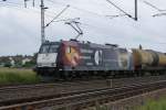 The advertising-locomotive 185 CL-002 of Veolia, which is advertising for Mannesmann-tubes is running through Brunswick on 28th June 2009.