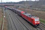 DB 185 179 hauls a steel train through Duisburg on 30 January 2018.