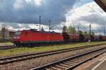 DB Cargo 185 167 hauls a cereals train through Stendal on 28 April 2016.