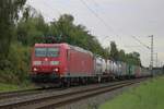 Intermodal train hauled by DB Cargo 185 132 passes through Kaarst-Broicherseite (a famous photo spotting point between Neuss and Meerbusch-Osterrath stations) on 8 August 2025.