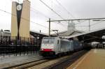 RailPool/ERS/BLS 186 103 speeds through Tilburg on 4 April 2014.