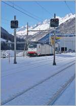 Railpool 186 497 waits in Airolo until its train is loaded with excavated material to transport it to Flüelen. The loading process takes about two hours. This picture was taken during a brief moment when the sun also reached this part of the station.

January 25, 2025