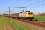 ECR locomotive 186301 is passing in Lokeren with the  Evian  train going to Antwerpen, 1/4/2025