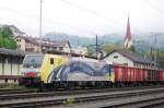 Lokomotion 189 912 in advertising livery urging us to drink more milk stands at Kufstein with a steel scrap train bound for Italy, 20 May 2010.