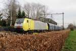 MRCE-Dispolok 189 995 (one of the few MRCE/Dispolok 189s in the original yellow-silver livery) passes Wijchen with a coal train from Emmerich on 27 February 2014.