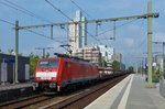 Empty car train with 189 053 speeds through Tilburg on 23 July 2016.