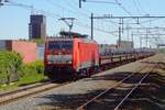 On 15 May 2019 a block train of steel coils gets hauled by 189 066, passing Nijmegen-Dukenburg toward Utrecht. 