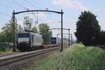 Ecco Rail 189 283 hauls a half-loaded LKW Walter intermodal train through Hulten on 5 June 2024.