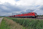 Iron Ore train with 189 043 and sister engine at the front thunders through Valburg on 2 July 2020.