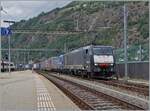 With the BEACON 189 992-1 ES 64 F4 092 at the front and an SBB  Re  193, a transit freight train reaches the Brig train station.