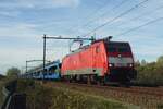 On 11 November 2022 (Armastice day but for the fact that the Netherlands did not take part in World War One) DBC 189 024 hauls an empty automotive train through Tilburg-Reeshof.