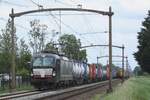 SBBCI X4E-660 hauls a seriously delayed intermodal train through Hulten on 5 June 2024. 
