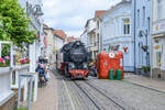 Bäderbahn »Molli« steam locomotive 99 2322-8 type 99.32 2-8-2T street running through Bad Doberan. Date: 7th June 2025.
