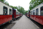 Two trains on the Mecklenburgische Bäderbahn pass each other at Heiligendamm station on the Baltic Sea coast. Date: 8th June 2025.