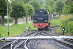 Steam locomotive 99 2322-8 from the Mecklenburgische Bäderbahn is running around at the terminus Kühlungsborn West.
