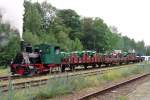 Anna-3, a German steam engine that used to be employed by a mining company, shunts a train full of tractors in Simpelveld on 12 July 2014.