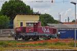 Diesel locomotive D 255-201 is in the sidings of Ferrara station.