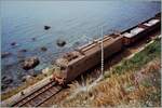 An old photo from my archive: Shortly after Taormina, an FS E 636 with a freight train travels along the sea.
