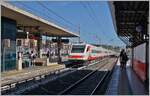 The FS Treniatila ETR 460 026 arrives in Civitavecchia as Frecciabianca FB 8620. The nine-car train is en route from Roma Termin to Milano Centrale (via Grosseto - Genoa). The ETR 460 021 - 030, with the axle arrangement (1A)'(A1)' + (1A)'(A1)' + 2'2' + 2'2' + (1A)'(A1)' + (1A)'(A1)' + 2'2' + (1A)'(A1)' + (1A)'(A1)', were built by Fiat Ferroviaria in 1995/1996. In 1996, trains 21, 27, and 28 were modified for service to France and designated ETR 463. The background on the left side of the image is also interesting, although I lack detailed information to comment on what I see. 

September 19, 2025