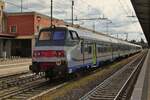 With the control car in front, the train is standing on a central track in the station Verona Porta Nuova.