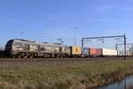 RFO 2019 303 hauls a container train through Valburg on 9 March 2025.