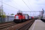 A blueish grey picture of 6435 with container train at Tilburg on 4 April 2014.