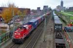 Container train with 6424 runs past Tilburg-Universiteit on 12 November 2015.