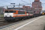 RFO 1837 stands with a sister engine and a rake of empties at Amersfoort on 27 April 2023.