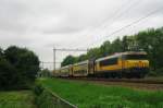 NS 1715 with commuter stock near Wijchen on 21 May 2013.