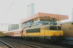 Scanned picture of 1774 with Mller coaches at Rotterdam Centraal on 22 July 2006 -against the sunlight. I used the building in the background to block the sun, but no flash was employed.