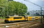 From behind the window of apassing train,NS 1712 was seen at Den Haag Centraalon 3 May 2010.