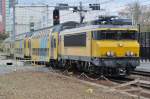 NS 1767 with double deck stock is about to call at Tilburg on 17 April 2015.