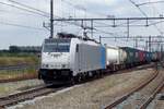 Railpool 186 297 hauls an intermodal freight through Breda on 18 July 2018.