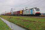 On a grey morning of 24 October 2024 Lineas 186 446 hauls a fully loaded ECS container train through Angeren towards Emmerich.