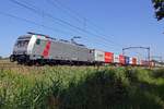 Tomorrow the green grass? On 28 June 2019 Akiem 186 359 hauls an intermodal train through Oisterwijk.