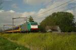 On 26 April 2019 NS/ATLU 186 214 hauls an IC-Direct through Oisterwijk toward Eindhoven.