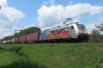 DB Cargo 186 492 hauls the Rühland mixed freight thropugh Oisterwijk toward Germany on 18 July 2020.