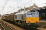 OPel train with 266 452 passes Roosendaal Centraal on 12 July 2004.