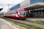 Totally refurbished PKP Wielkopolska Kolej EN57-1434 awaits departure at Poznan Glowny, main sttaion of the capital of Greater Poland (=Wielkopolska) Province, 5 June 2013.