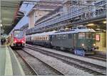 The Re 4/4 I 10039 is waiting in Lausanne with its special train 31131 to depart for the destination Zurich Enge. The Re 4/4 I now belongs to SWISS RAIL TRAFFIC and was previously on the Mittelthurgaubahn as Re 416 628 and was previously used by the SBB with the number 10039, which is still registered today. At that time, the locomotive, which was delivered on December 22, 1950, still had the chrome letters SBB - CFF or SBB - FFS on the side walls. 

December 11, 2024