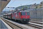 The SBB Re 4/4 II 11294 (Re 420 294-1)  100 Years of Circus KNIE  is in Spiez with a local freight train.