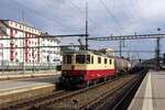 TEE liveried 11393 hauls a tank train through Olten on 20 May 2022.
