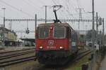 SSG 421 374 runs light through Payerne station on 31 December 2024.