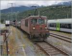 The BLS Re 4/4 195 reaches its destination Brig with its car tunnel train AT 3 from Iselle.