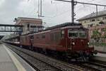 Very rapidly declining are the ranks of BLS Re 4/4II and freights are no longer hauled by these once ubiquitious machines. ON a very rainy 28 May 2019 BLS 185 hauls a freight through Spirz towards Brig.