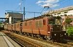 BLS 174 hauls two sister locos and an intermodal freight through Spiez on 13 September 2011.