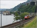 While an SBB Re 460 pushes its IR90 near Villeneuve towards Genève, the CGN paddle steamer  Italie  has arrived at the Château de Chillon.

June 8, 2024