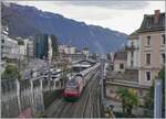 A SBB Re 460 with his IR is arriving at the Montreux Station.