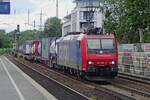 On 8 June 2016 SBB Cargo 482 001 hauls an intermodal train through Köln Süd.