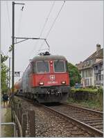The SBB Cargo Re 6/6 11669 (620 069-5)  Hägendorf  wiht a Cargo Service  ont the way to Biel/Bienne by Ligerz.